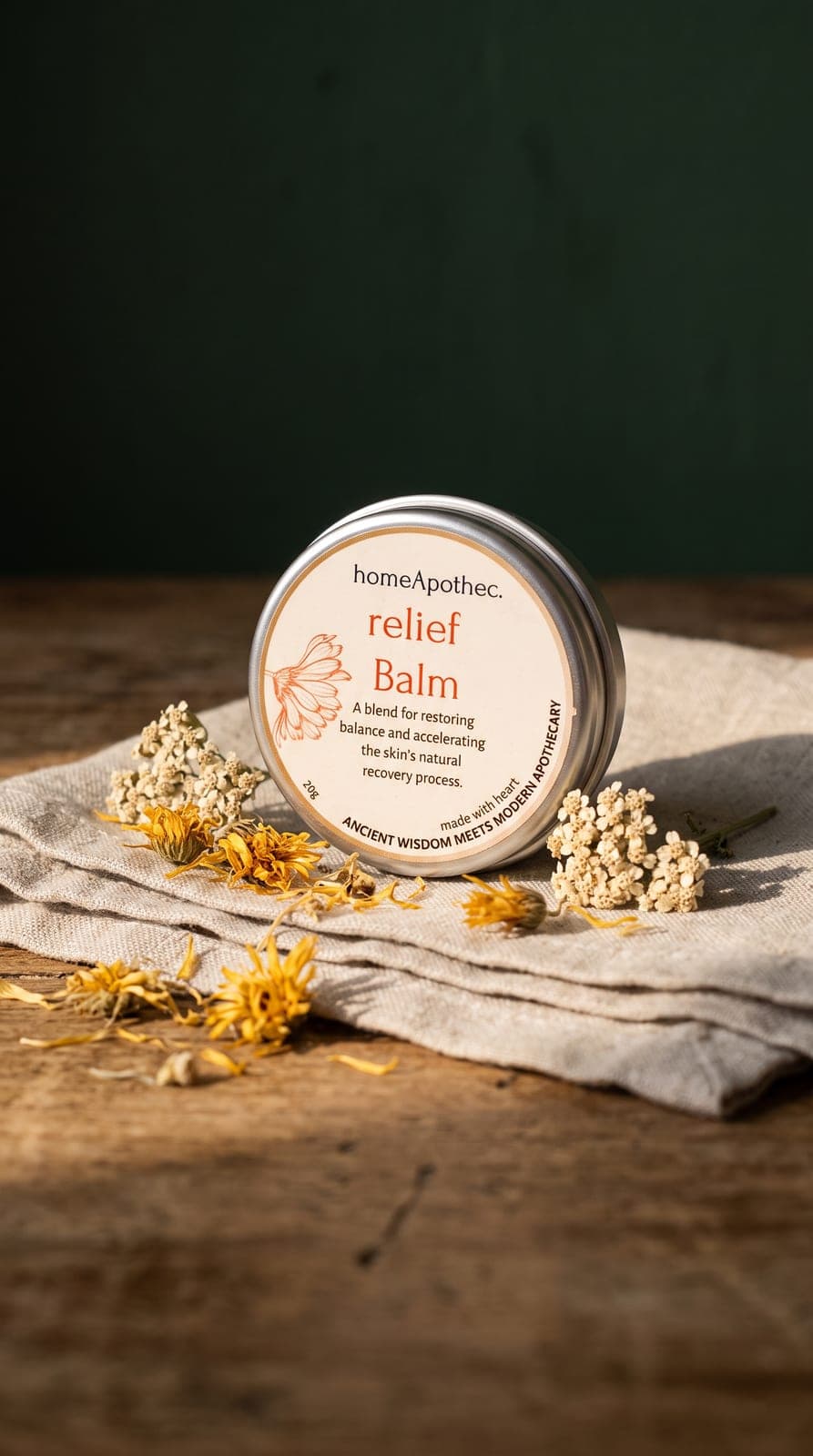 Relief Balm 20g tin on linen with dried calendula and yarrow