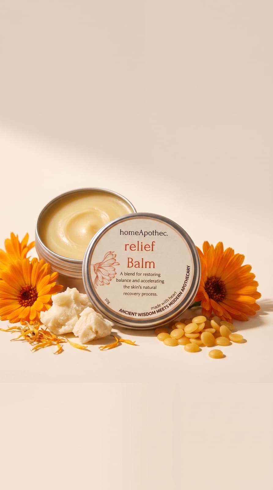 An open tin of Relief Balm with fresh and dried calendula, shea butter and beeswax