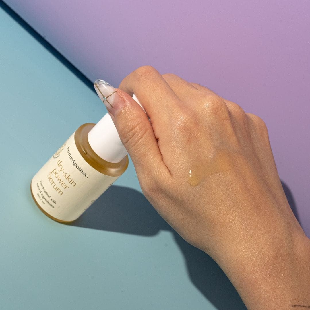 Dry Skin Power Serum with a swatch on the back of a hand