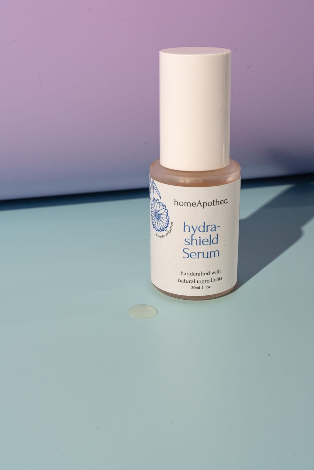 HydraShield Serum with a drop beside it